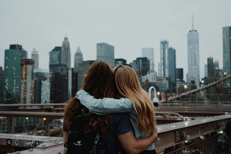 A couple enjoying the view of the New York skyline.